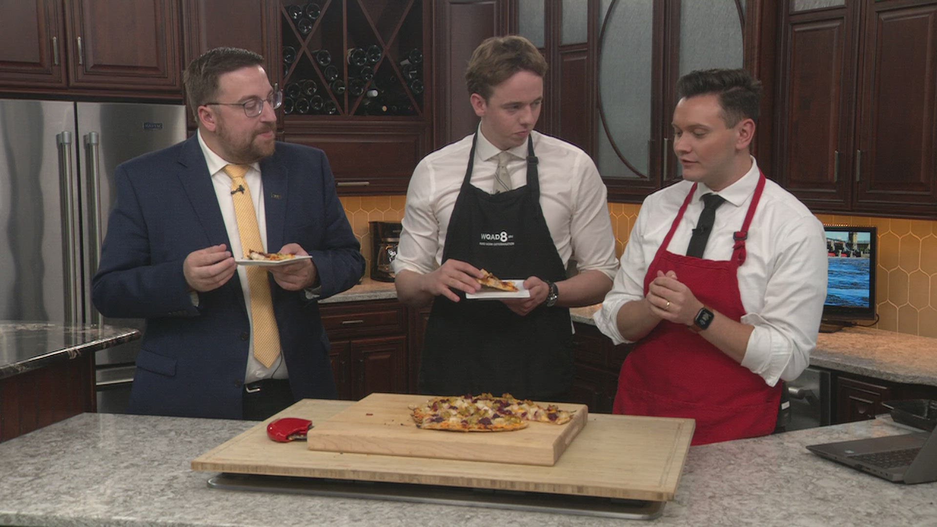 News 8's Joe McCoy, Andrew Stutzke and David Bohlman try Thanksgiving pizza.