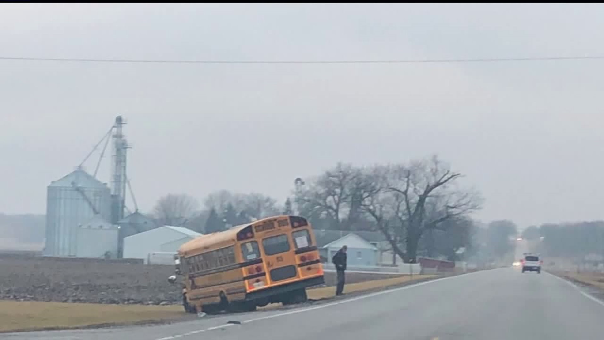 School bus & car crash, both vehicles end in ditch in Geneseo