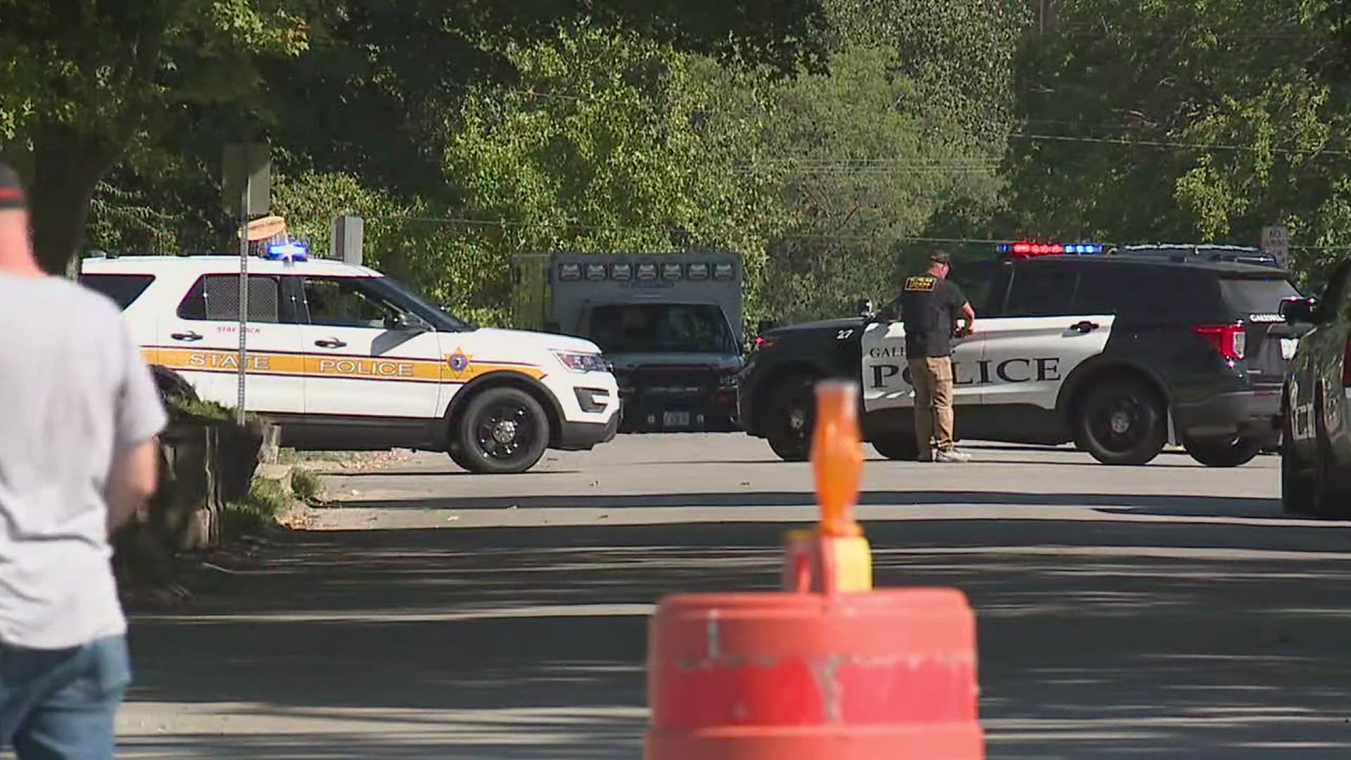 One of the officers shot during the altercation has been discharged from the hospital. A suspect has been barricaded inside a home near the campus.