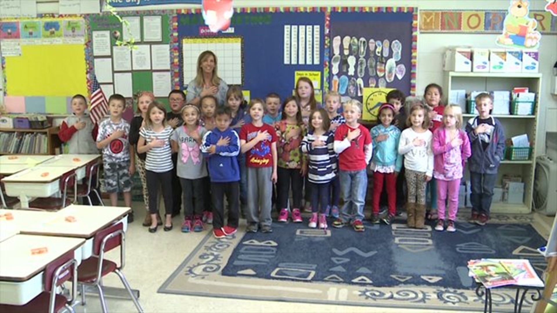 Mrs. Hillyer`s class says the Pledge of Allegiance