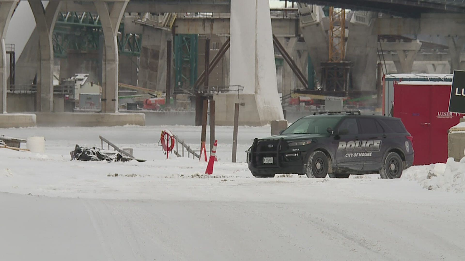 Around 6:15 on Sunday morning, a construction worker found tire tracks and a hole in the ice. One man is in critical condition, the other dead.