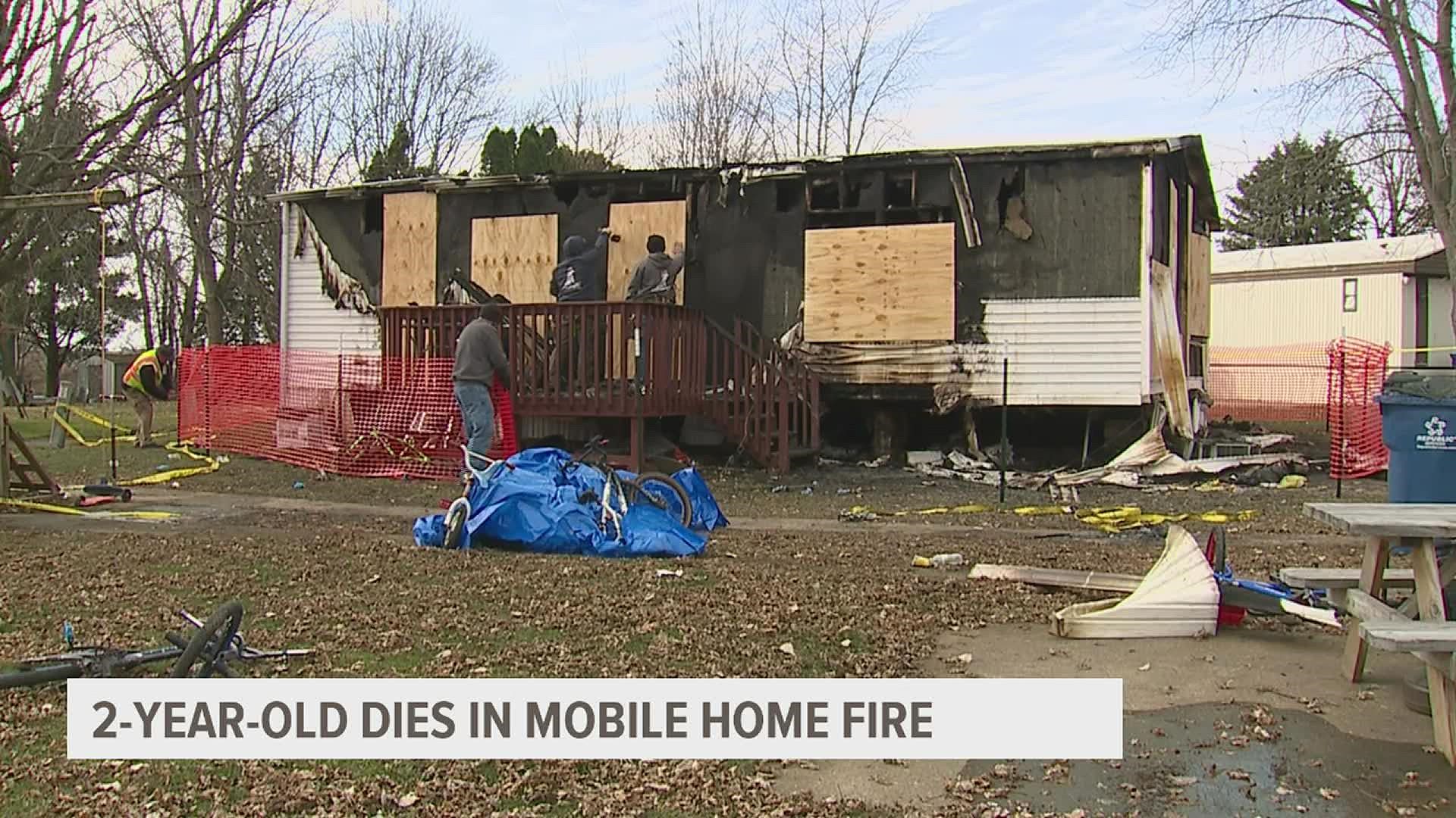 A fire broke out at a mobile home in Walcott, Iowa early Monday, and while six residents were able to escape, a two-year-old was found deceased in a back room.