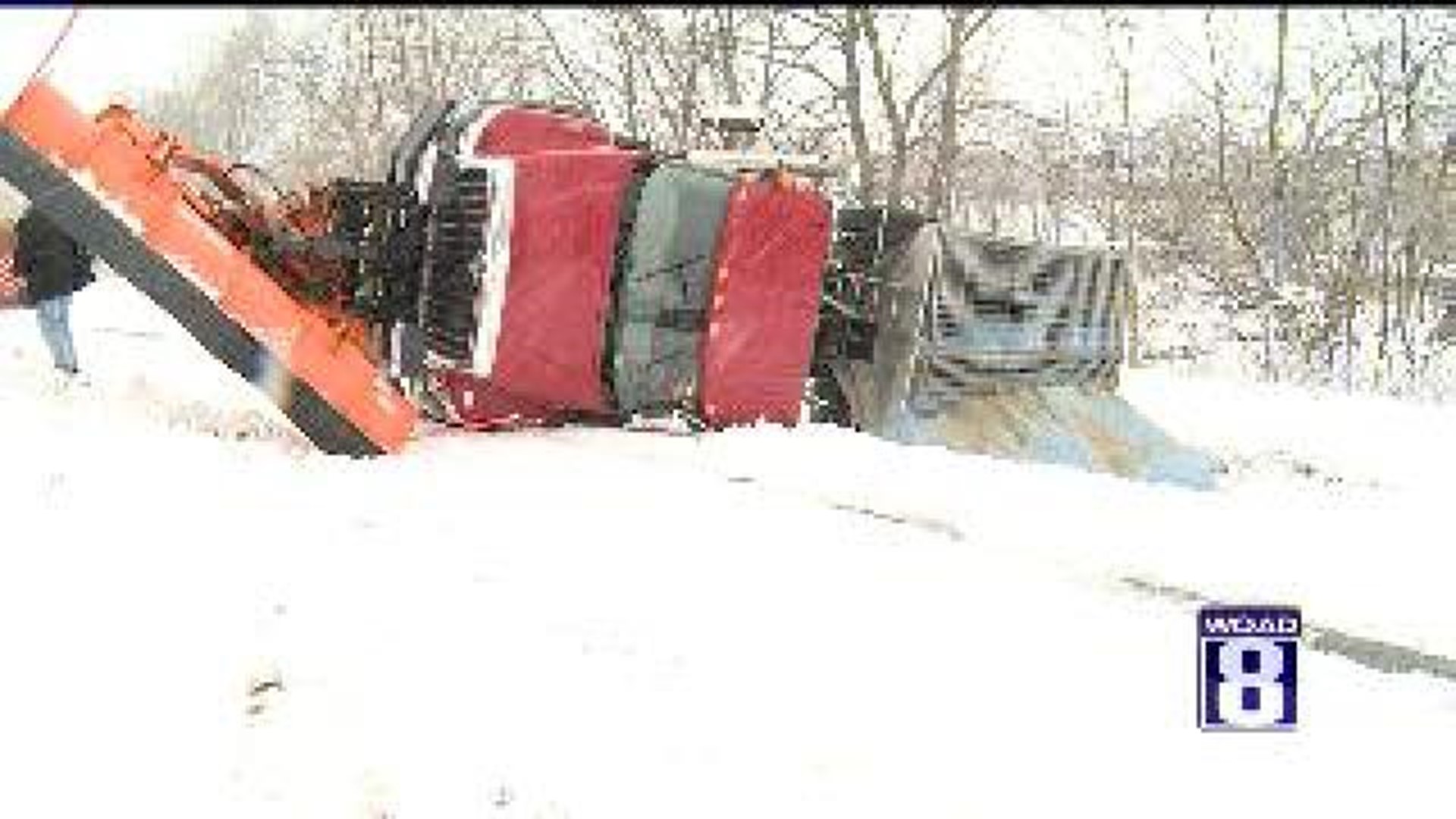 Snow plow overturns in Moline