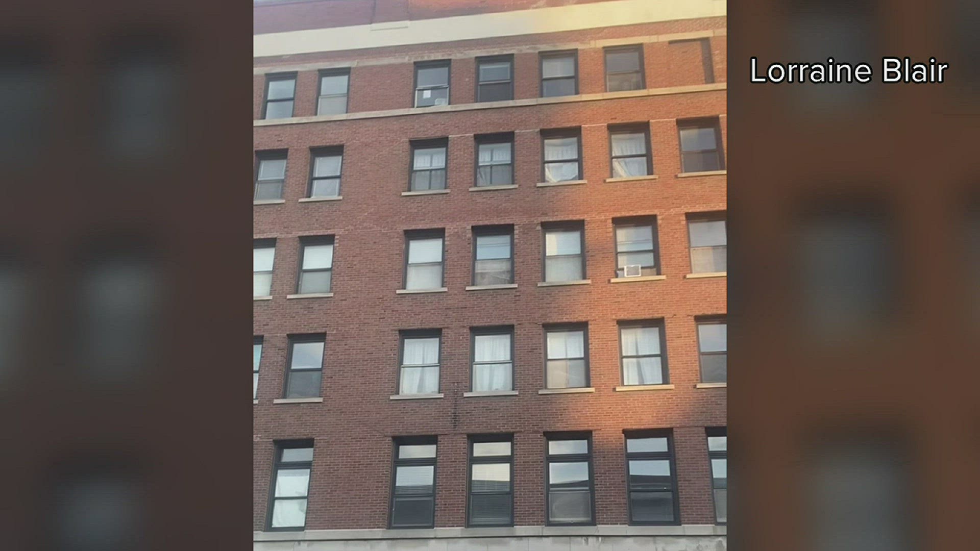 Lorraine Blair captured this video of a woman appearing at a window of the condemned apartment building that partially collapsed Sunday May 28.