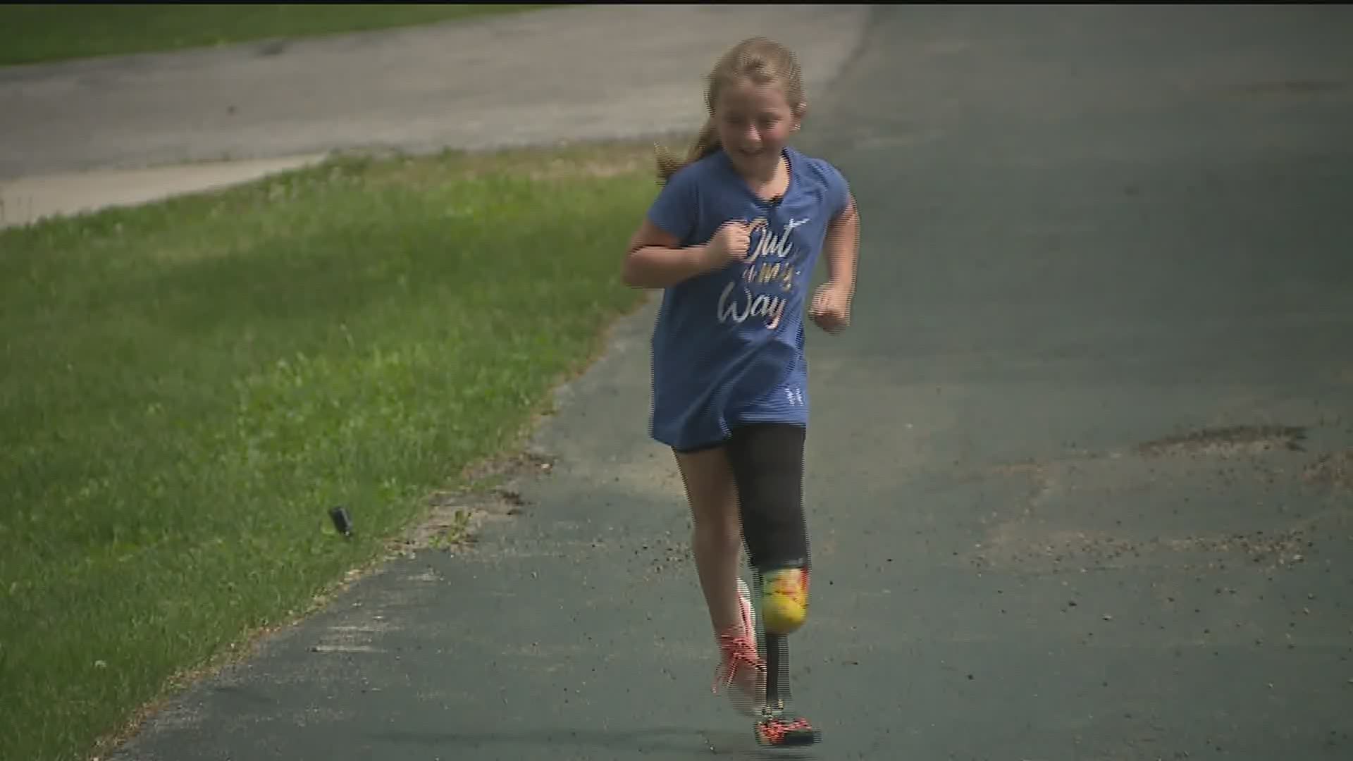 Maizie's new prosthetic running blade was a gift from the group called 50Legs in Florida.