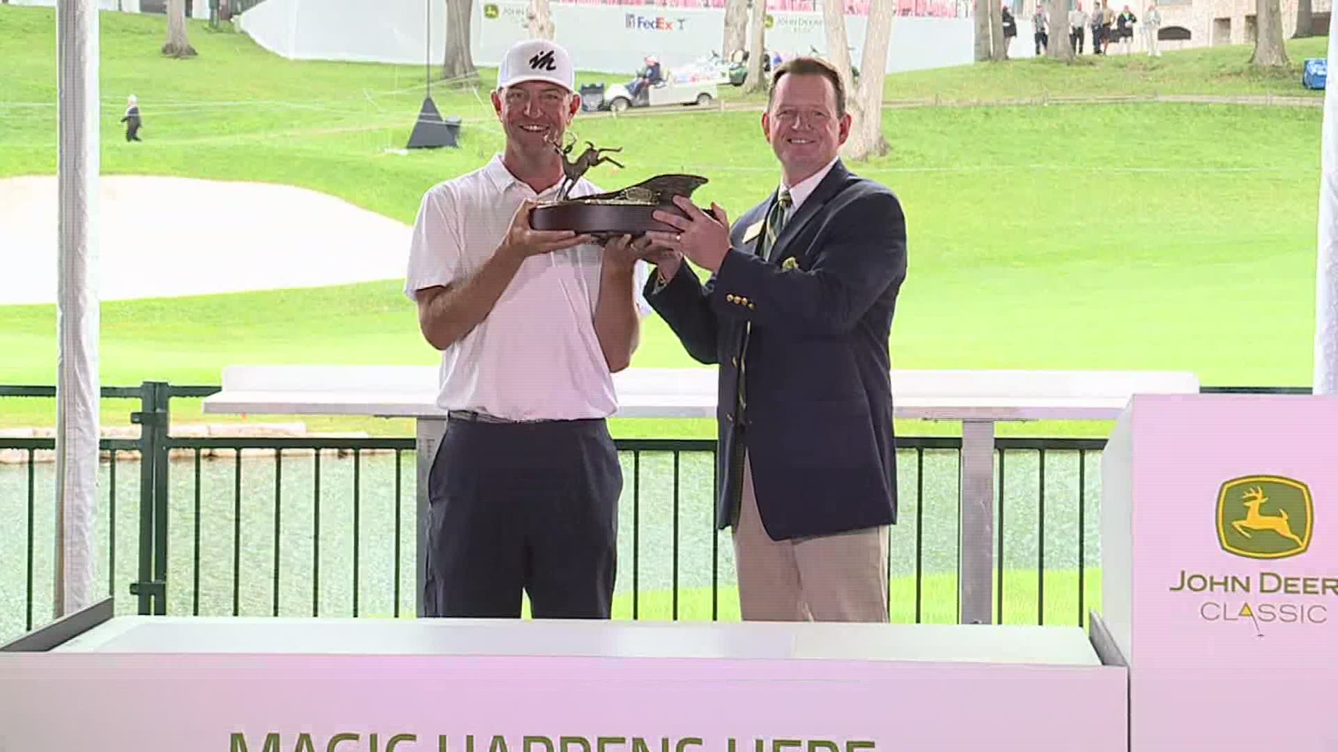 Lucas Glover won the 2021 John Deere Classic. He was presented with a check for more than $1.1 million and the bronze deer.