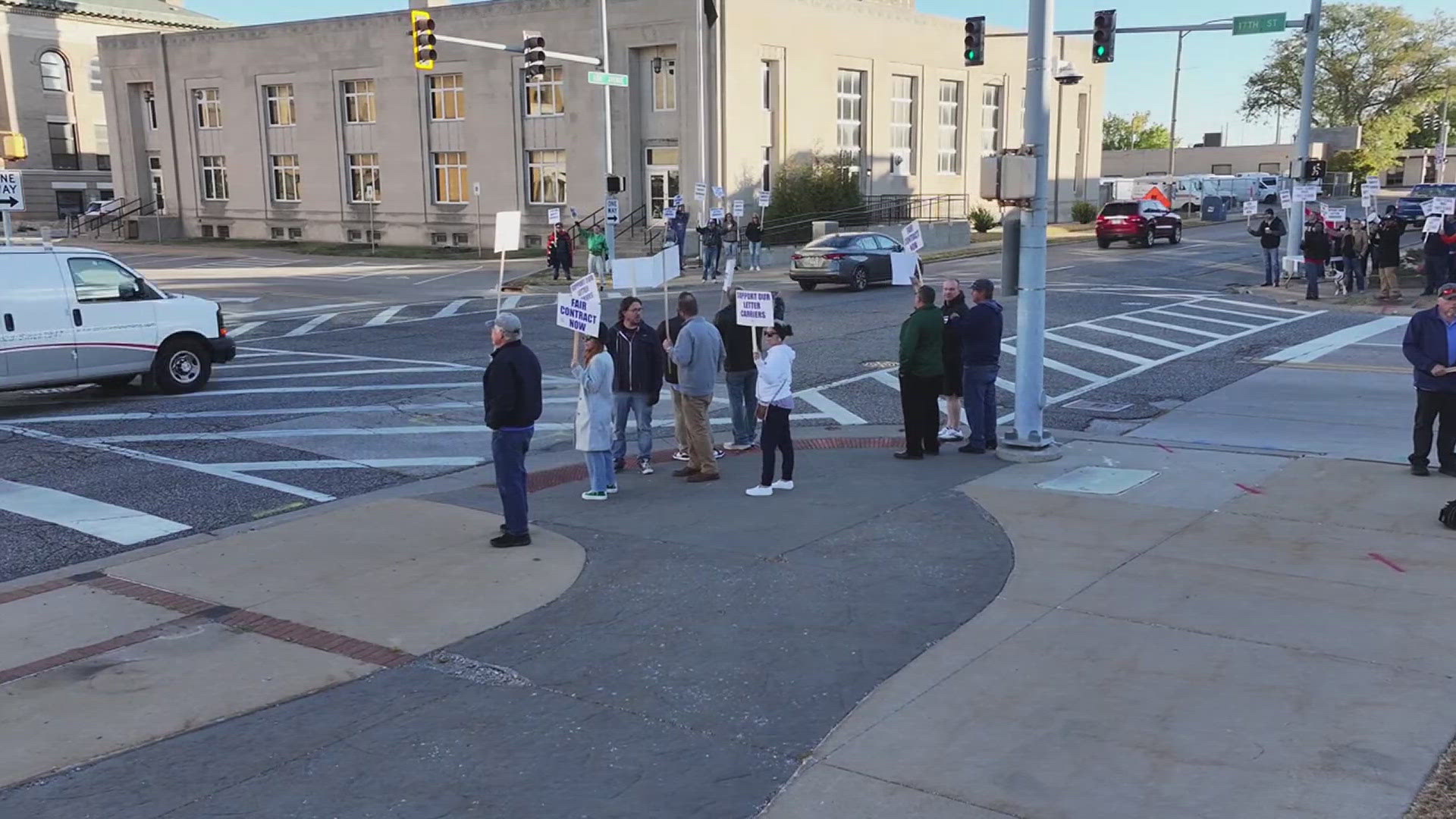 Nearly 50 letter carriers from around the Quad Cities gathered outside of the post office in Moline to make their demands public.