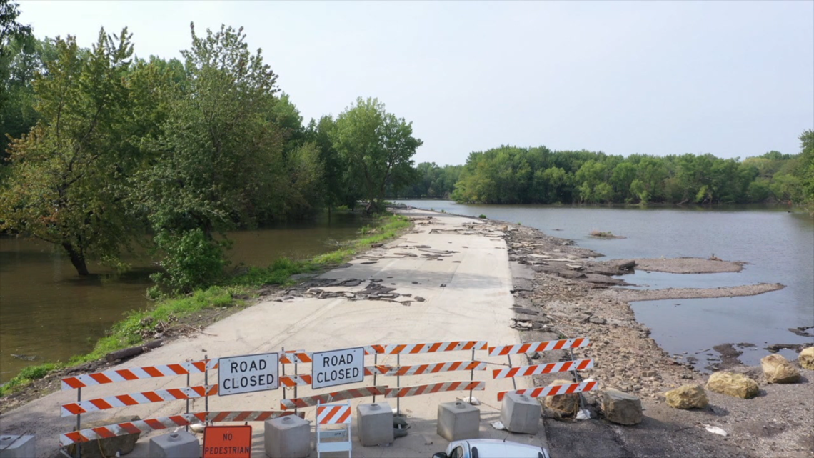 Watch Dubuque flood waters carry dumpster down avenue