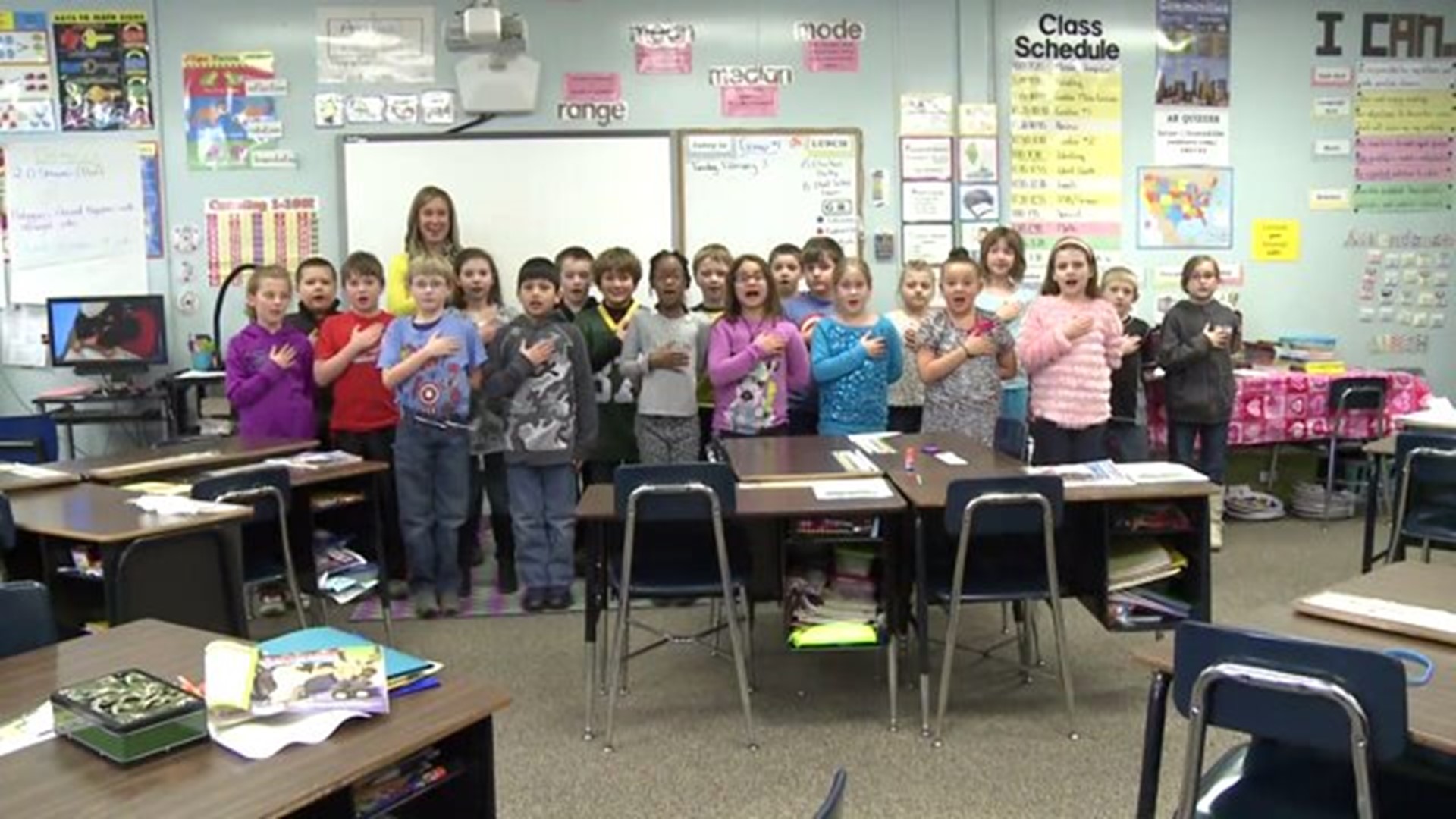 Mrs. Colwell`s class says the Pledge of Allegiance