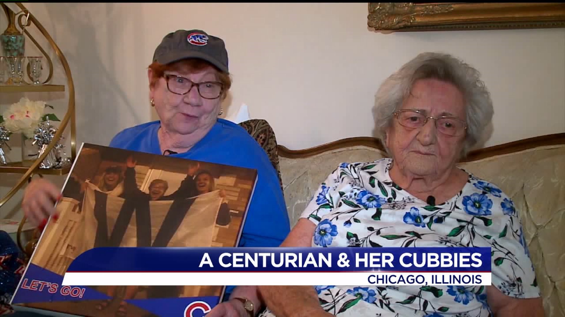 100-year-old roots on her Cubbies with her sassy 93-year-old sis