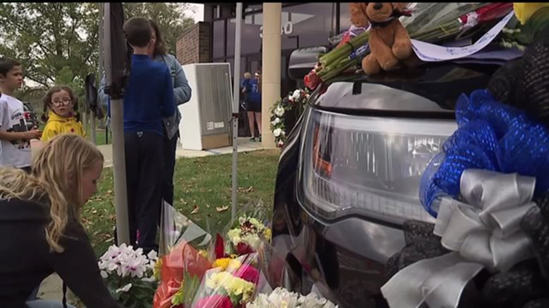 Des Moines mourns two officers killed in overnight ambush shooting