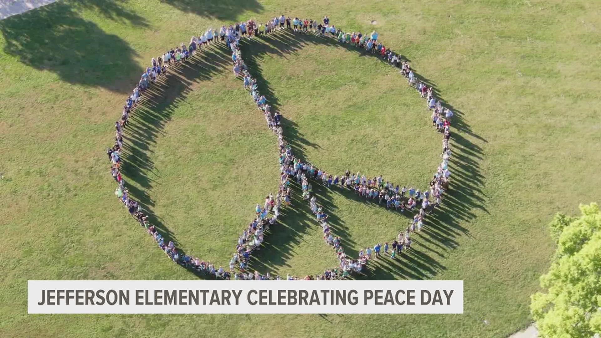 Students from Muscatine's Jefferson Elementary celebrated World Peace Day with a human peace sign.