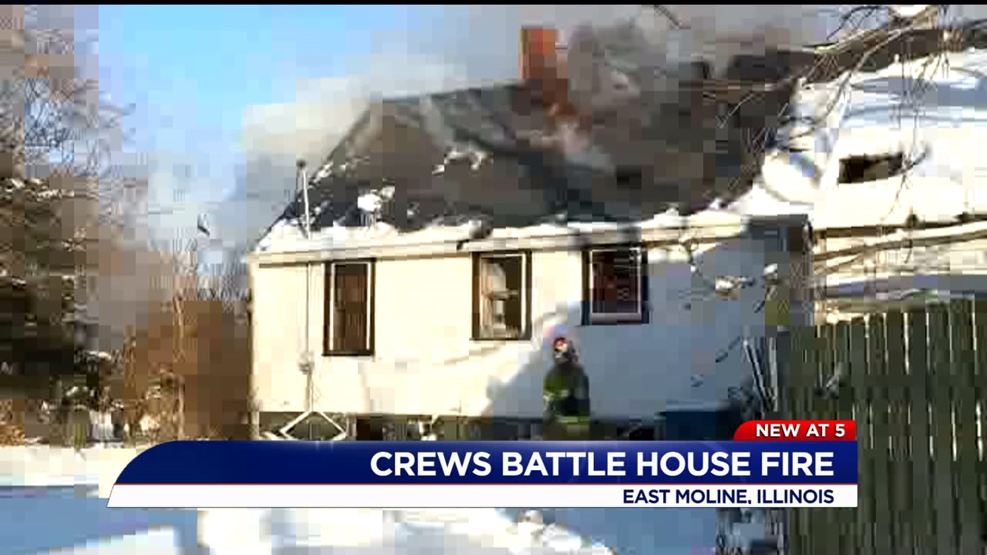 Crews battle house fire