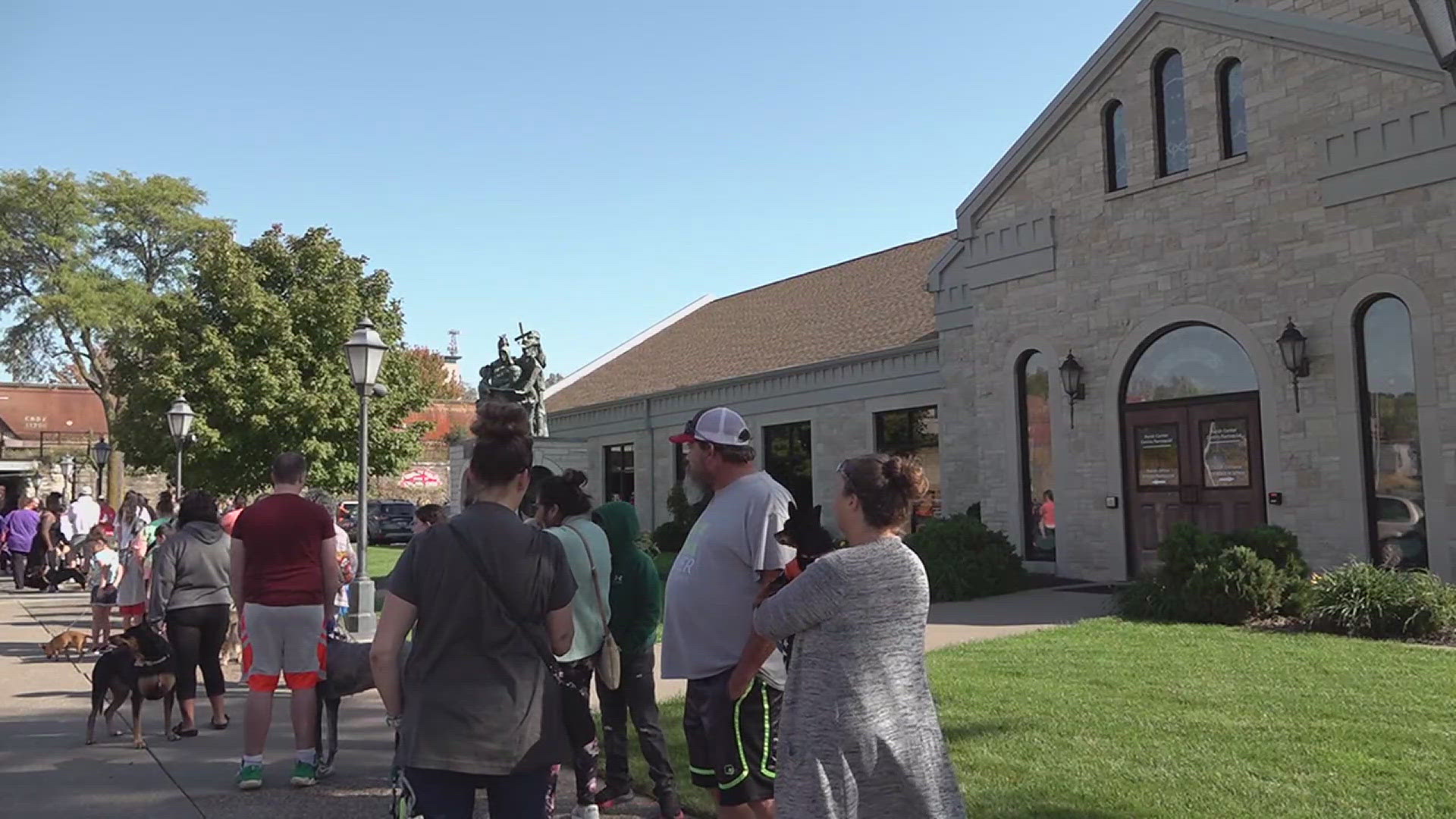 Many dogs and owners stood outside Saint Anthony's church in downtown Davenport to get a holy water blessing in honor of Saint Francis.