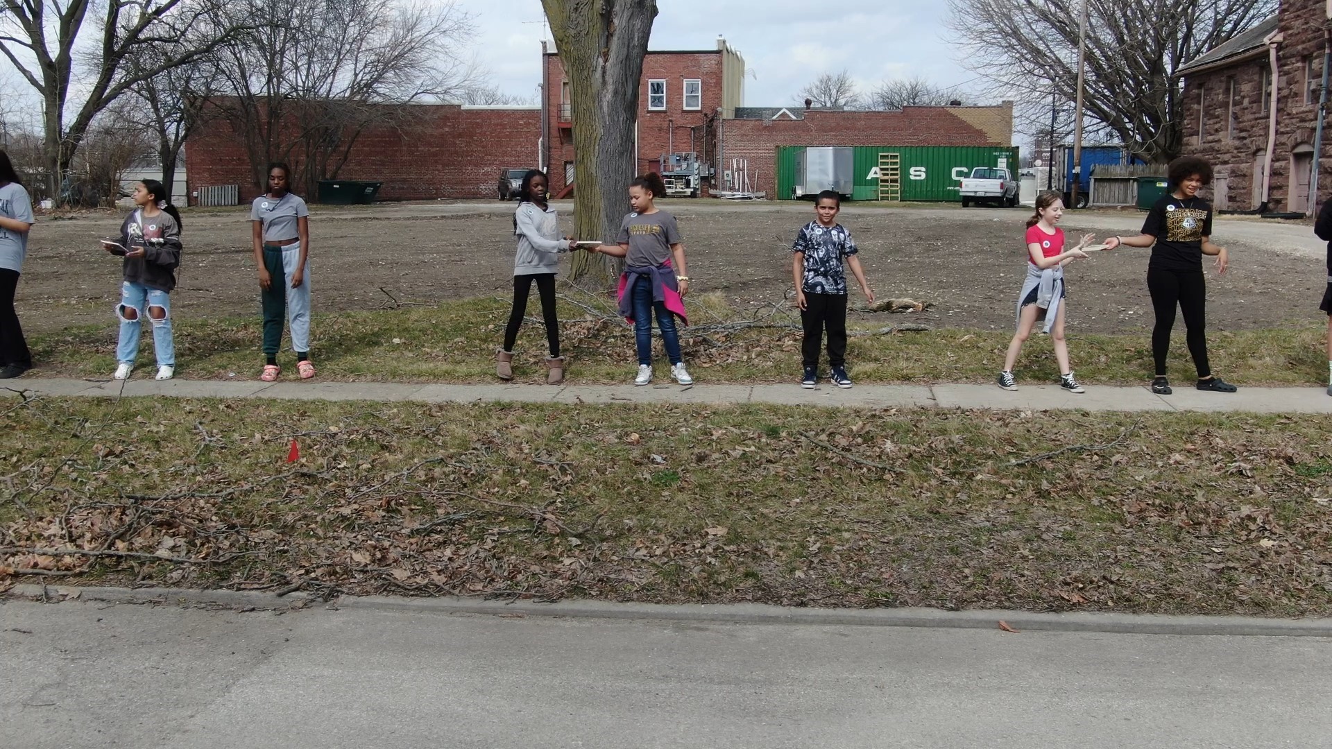 Lombard Middle School fifth and sixth grade students passed off 450 books by hand down two and a half blocks from the old Galesburg library to the new one.