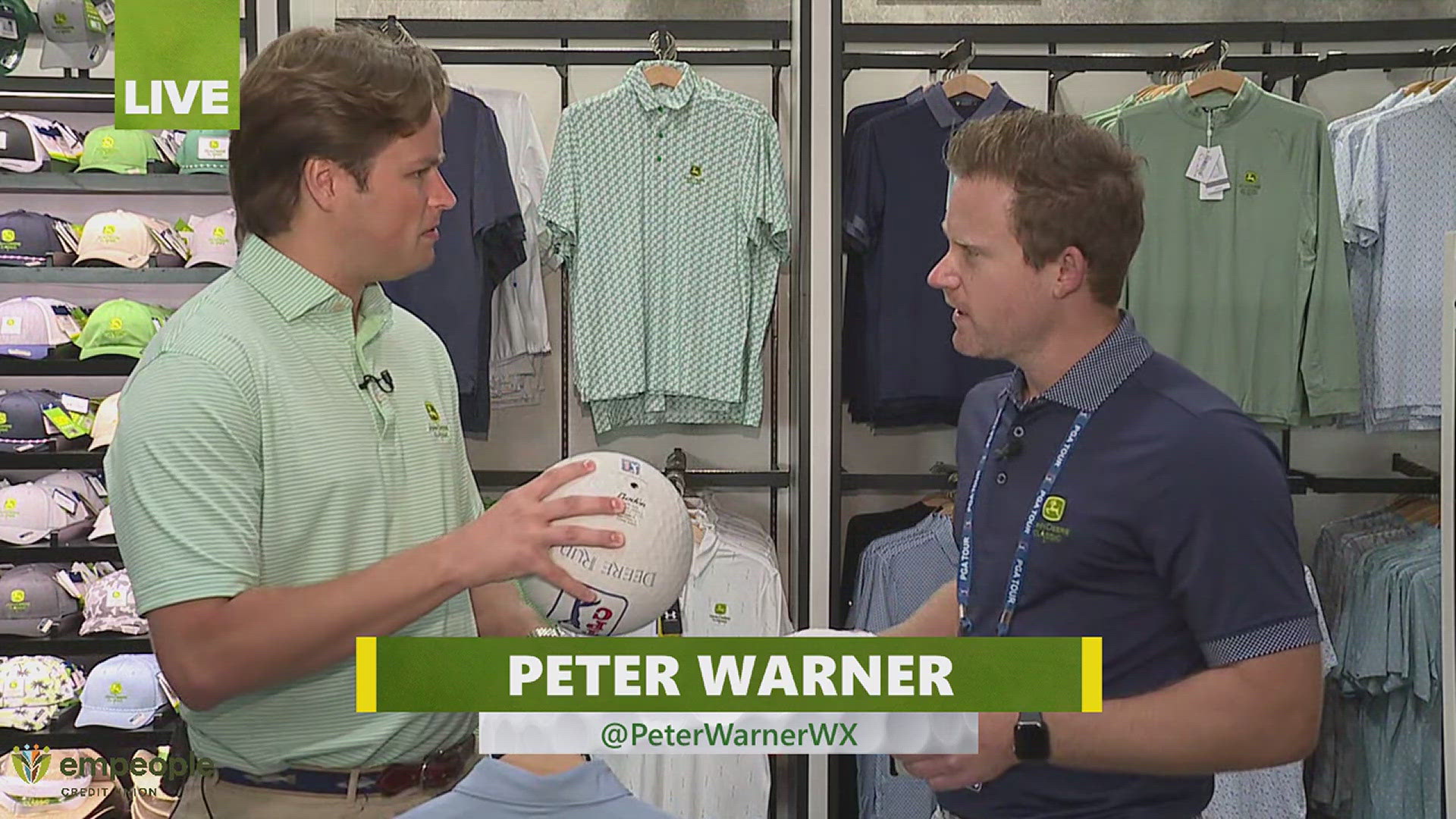 Peter Warner gives a look at some of the gear available at the John Deere Classic merch shop. 