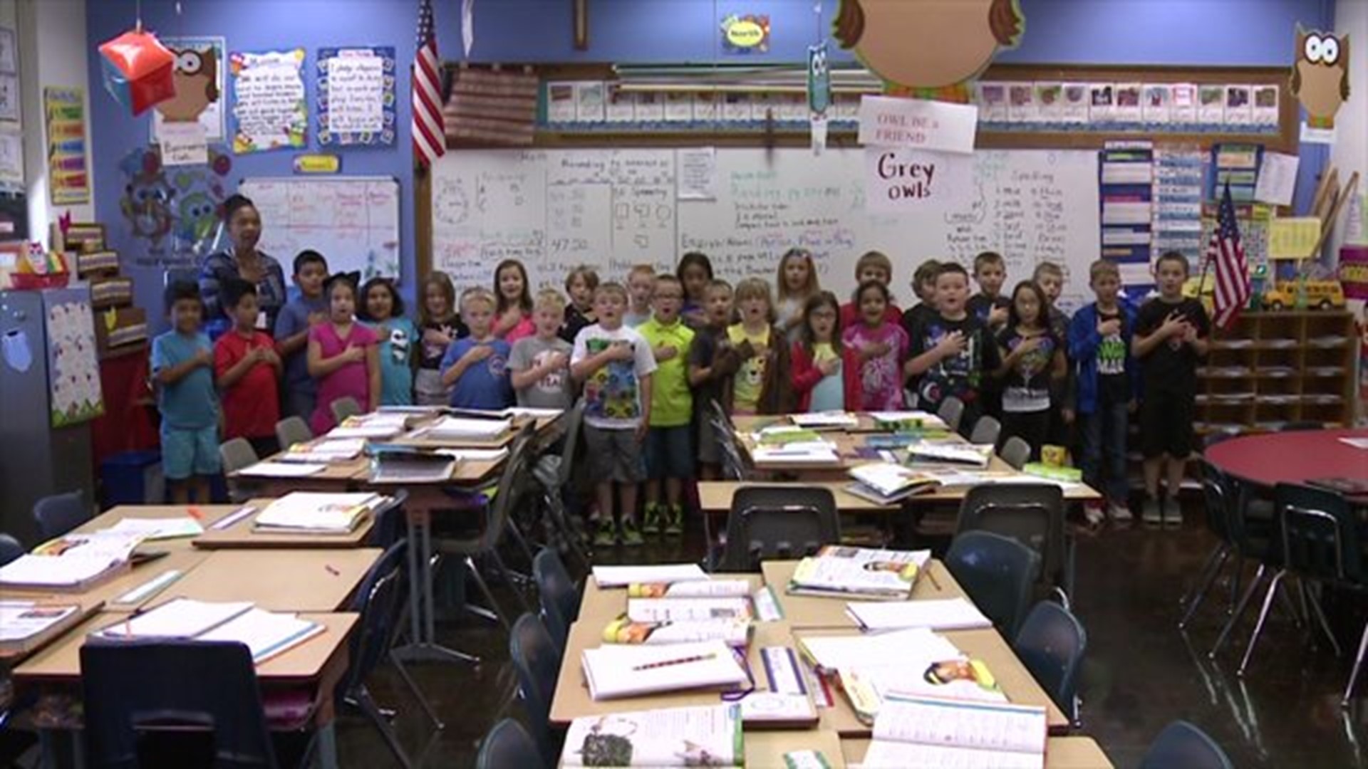 Mrs. Carter`s class says the Pledge of Allegiance
