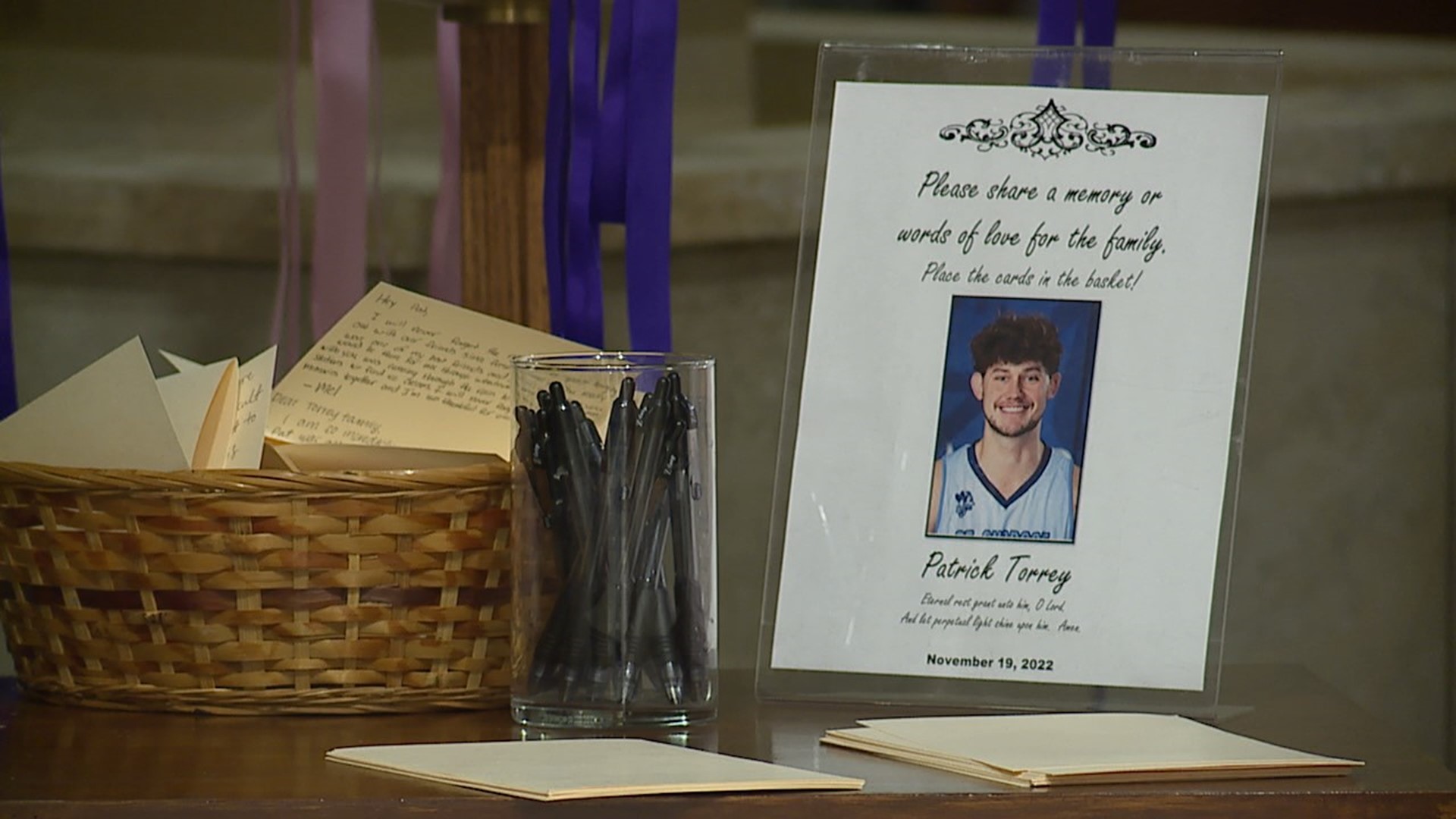 Family, students and university staff packed the Christ the King Chapel on Monday for a prayer service to remember the basketball player who recently passed away.