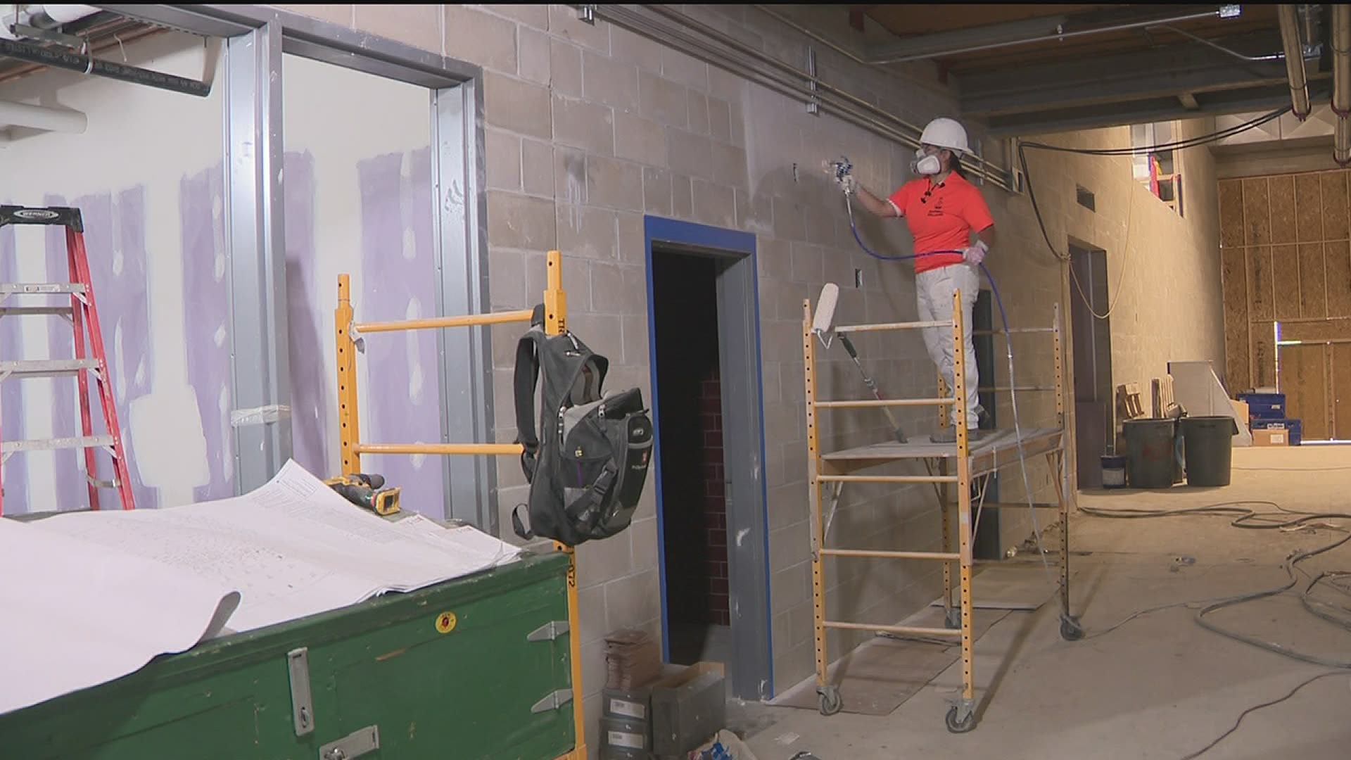 Skilled to Work: Finishers priming and painting at new Moline High School athletic facility