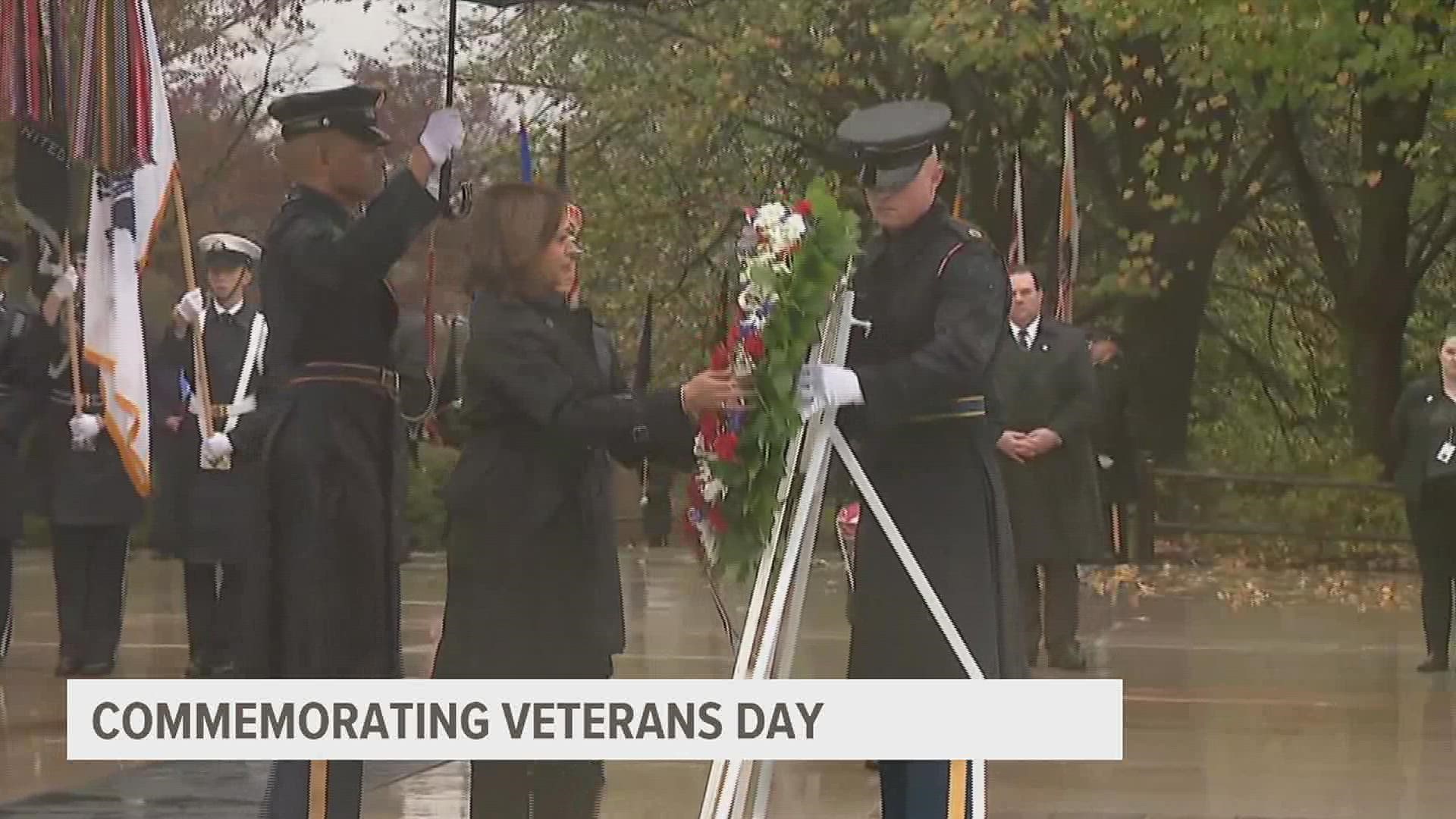Under gray clouds and pouring rain at Arlington National Cemetery, Vice President Kamala Harris has told the nation's veterans their work makes America stronger.