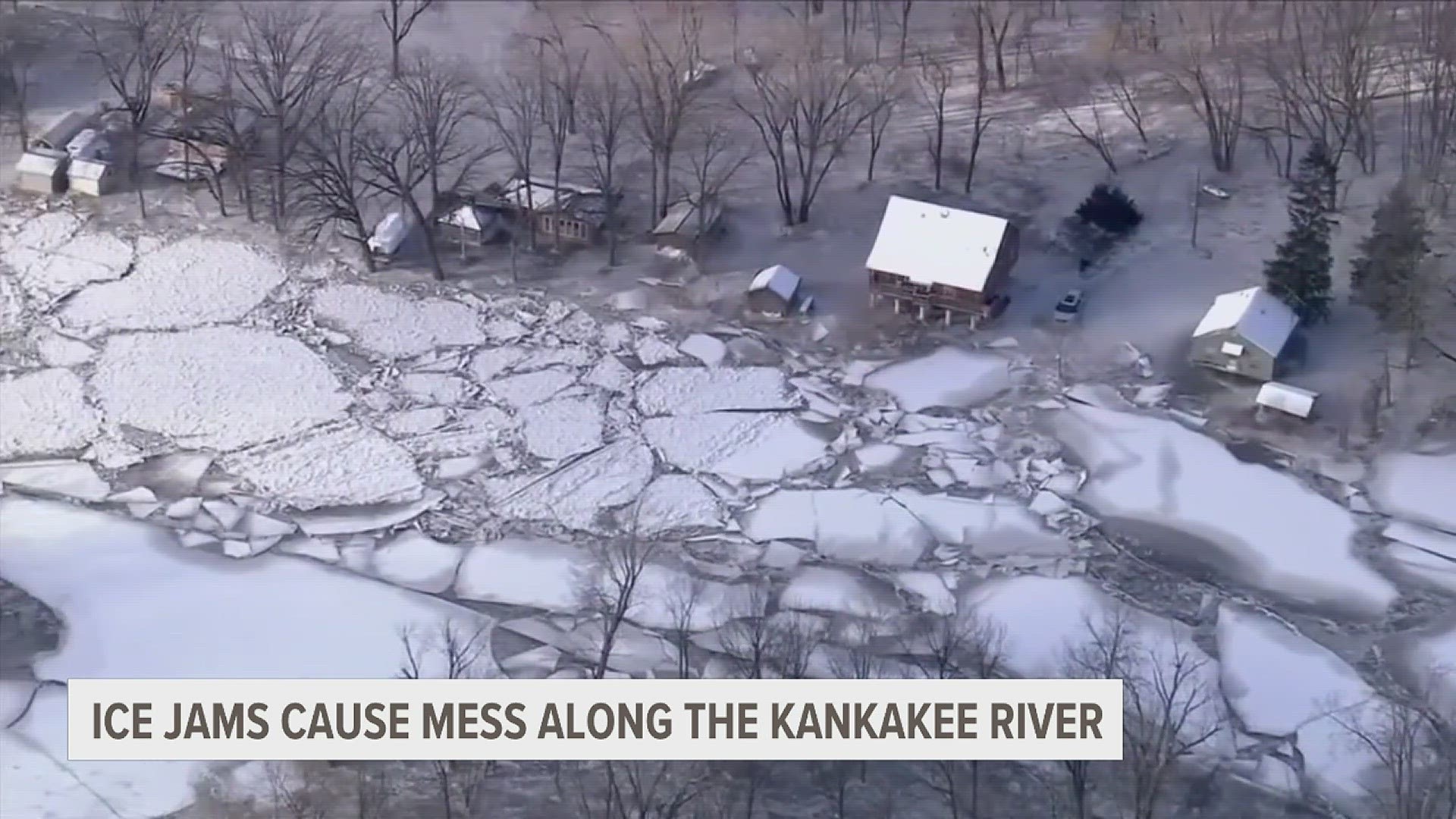 Multiple homes and cars were surrounded by water frozen into ice.