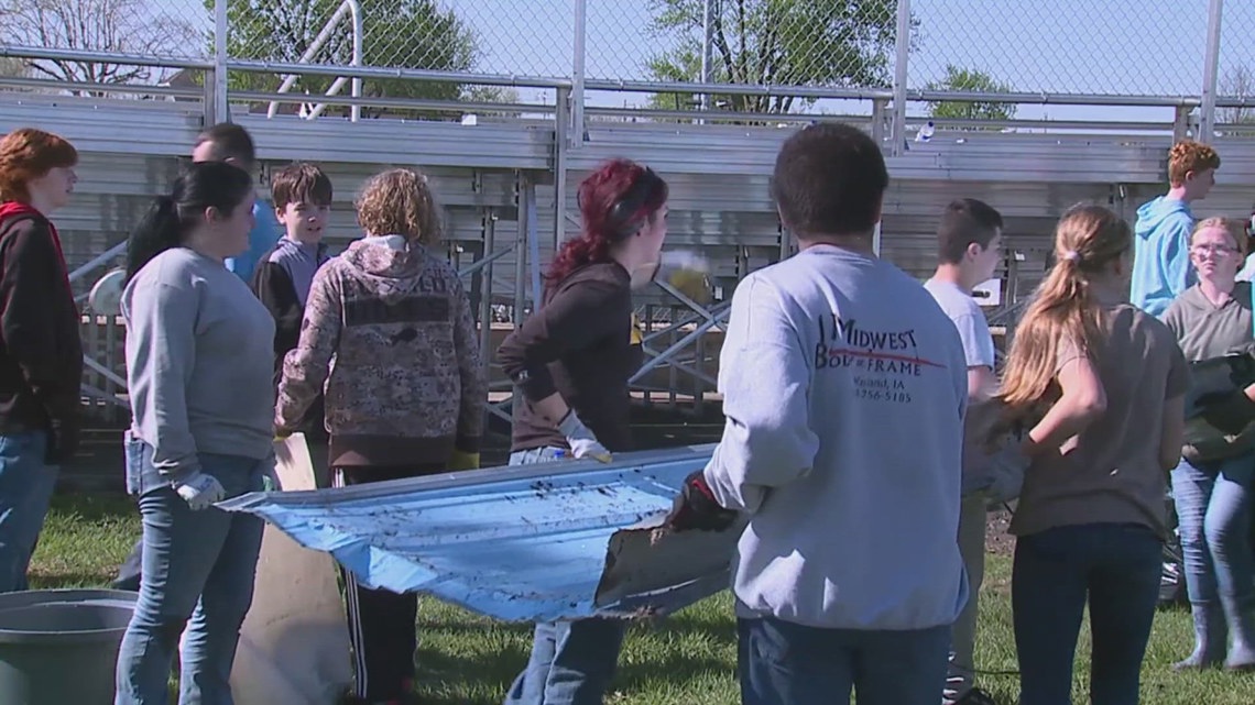 Students and community members in Wayland, Iowa, come together for storm debris cleanup