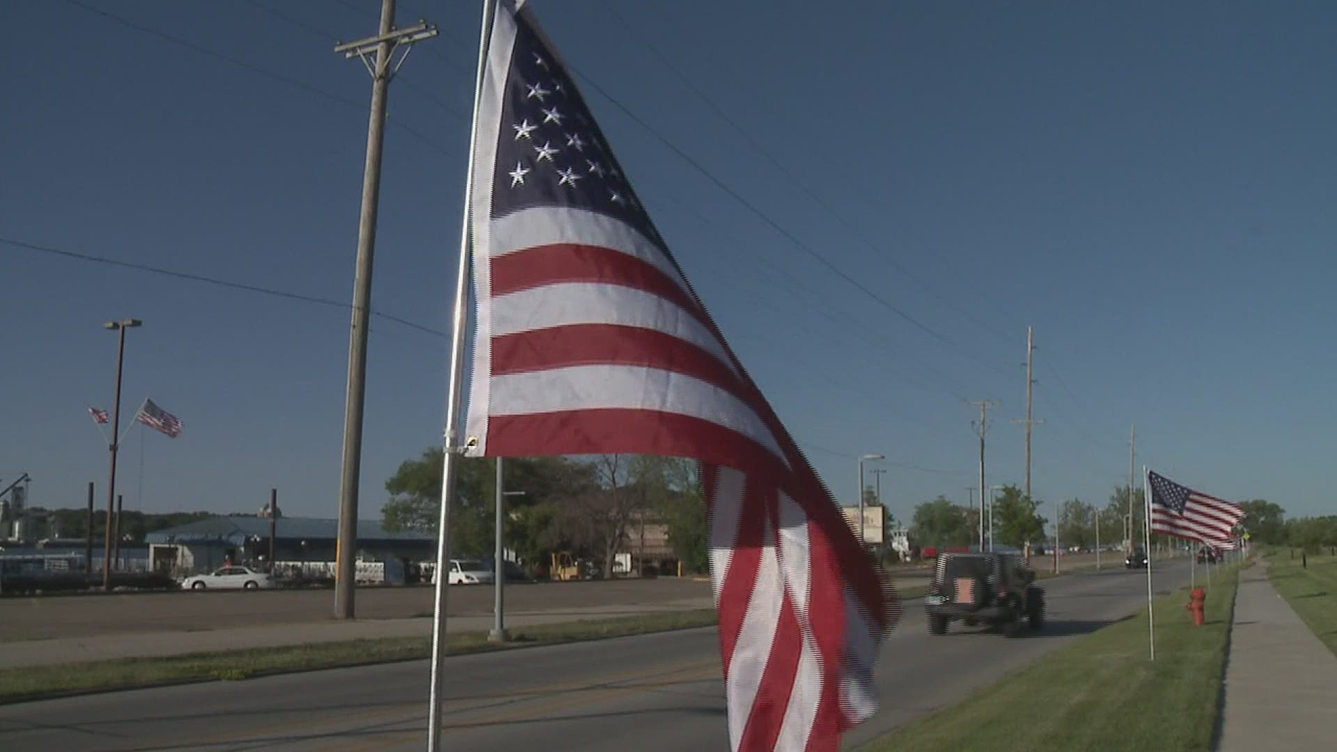 Selling flags is the Optimist Club's main fundraiser each year. The group is putting out more than 1,000 flags this year.