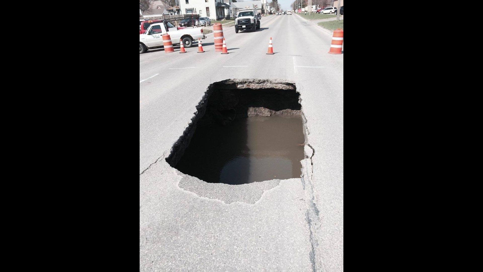 Photos: Sink hole opens up in West Burlington street | wqad.com