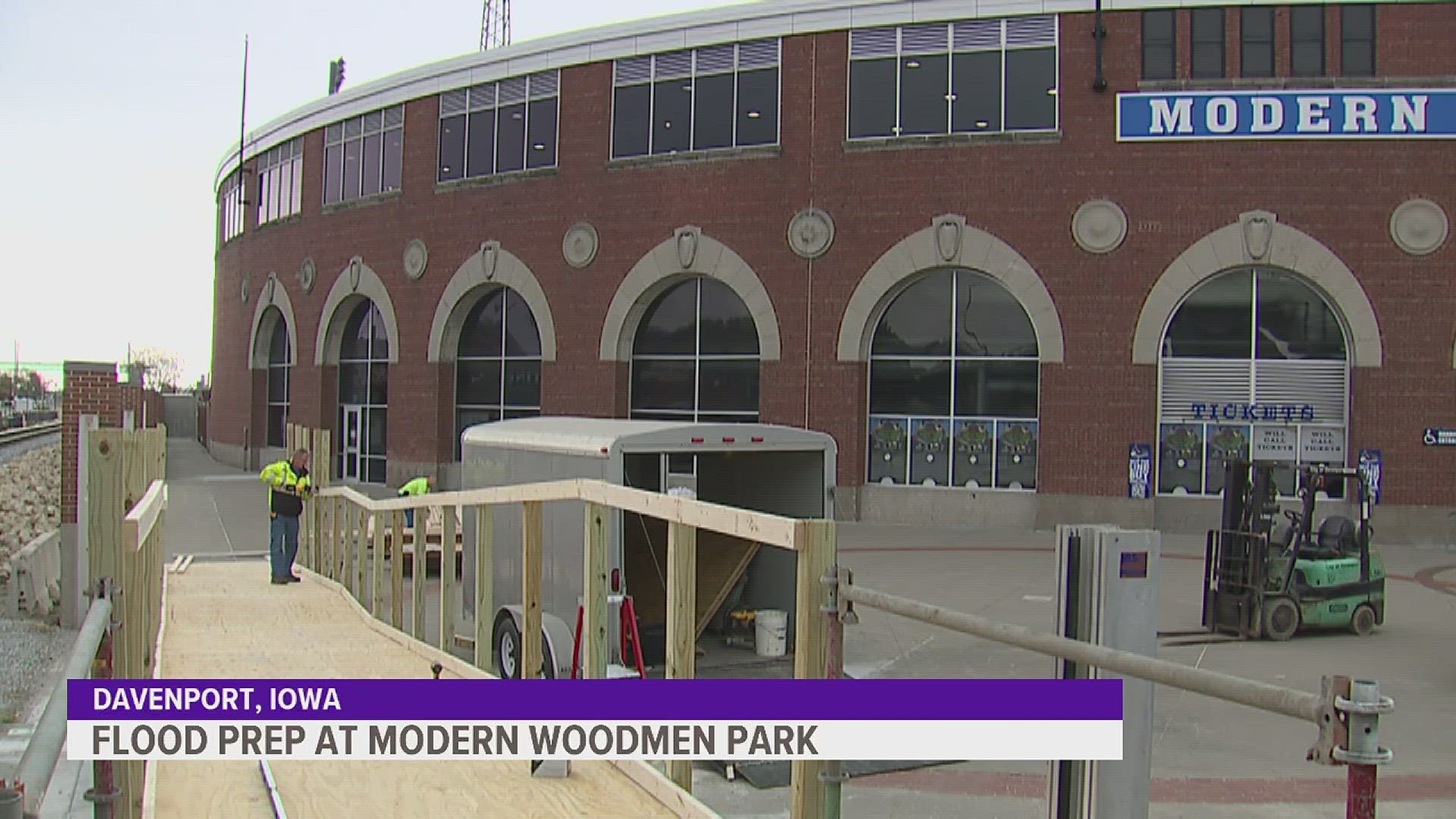 Flood walls and temporary walkways are being installed to make sure that fans and players can still enjoy River Bandits baseball as river levels rise.