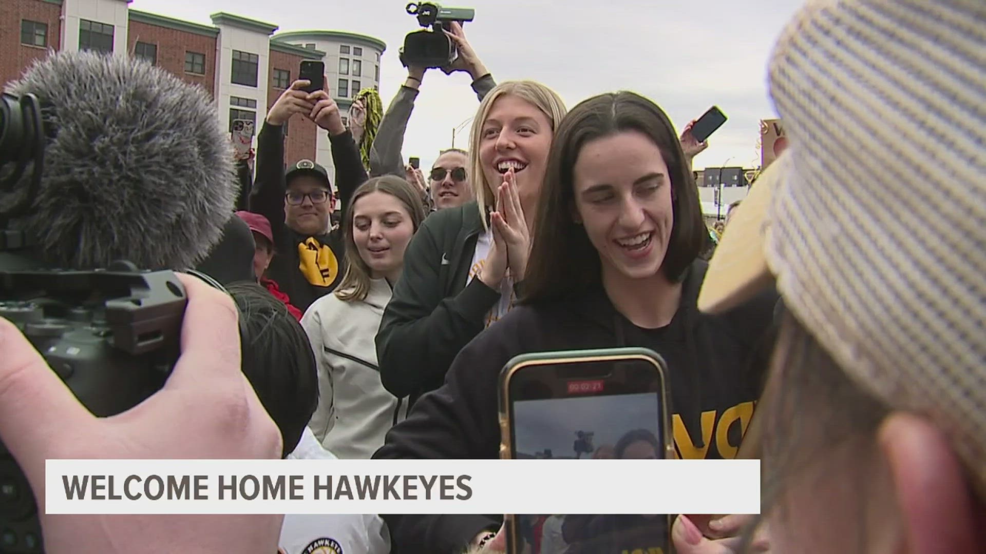 Hundreds of supporters crowded the streets of the Iowa River Landing, celebrating the return of the women's basketball team.