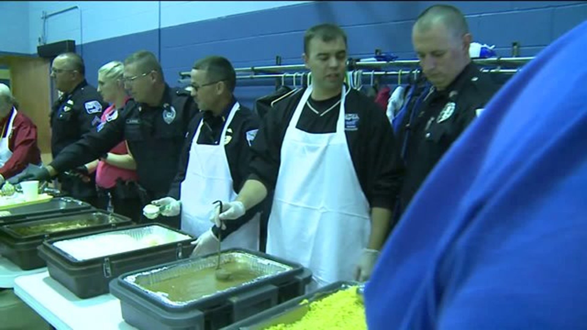 Davenport Police Department serving Thanksgiving Dinner to HCD