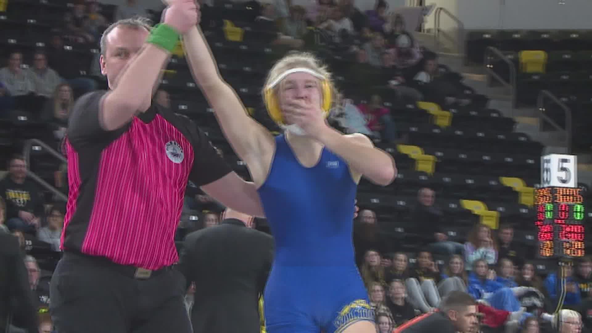 Girls Wrestling finally gets sanctioned by the IGHSAU. As for the State Meet, Ella Schmit wins her third straight title, Hannah Rogers claims her first title.