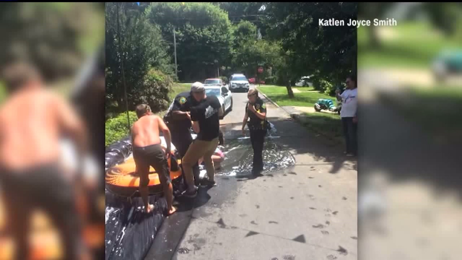 Police respond to complaint about Slip N Slide, but join in the fun instead