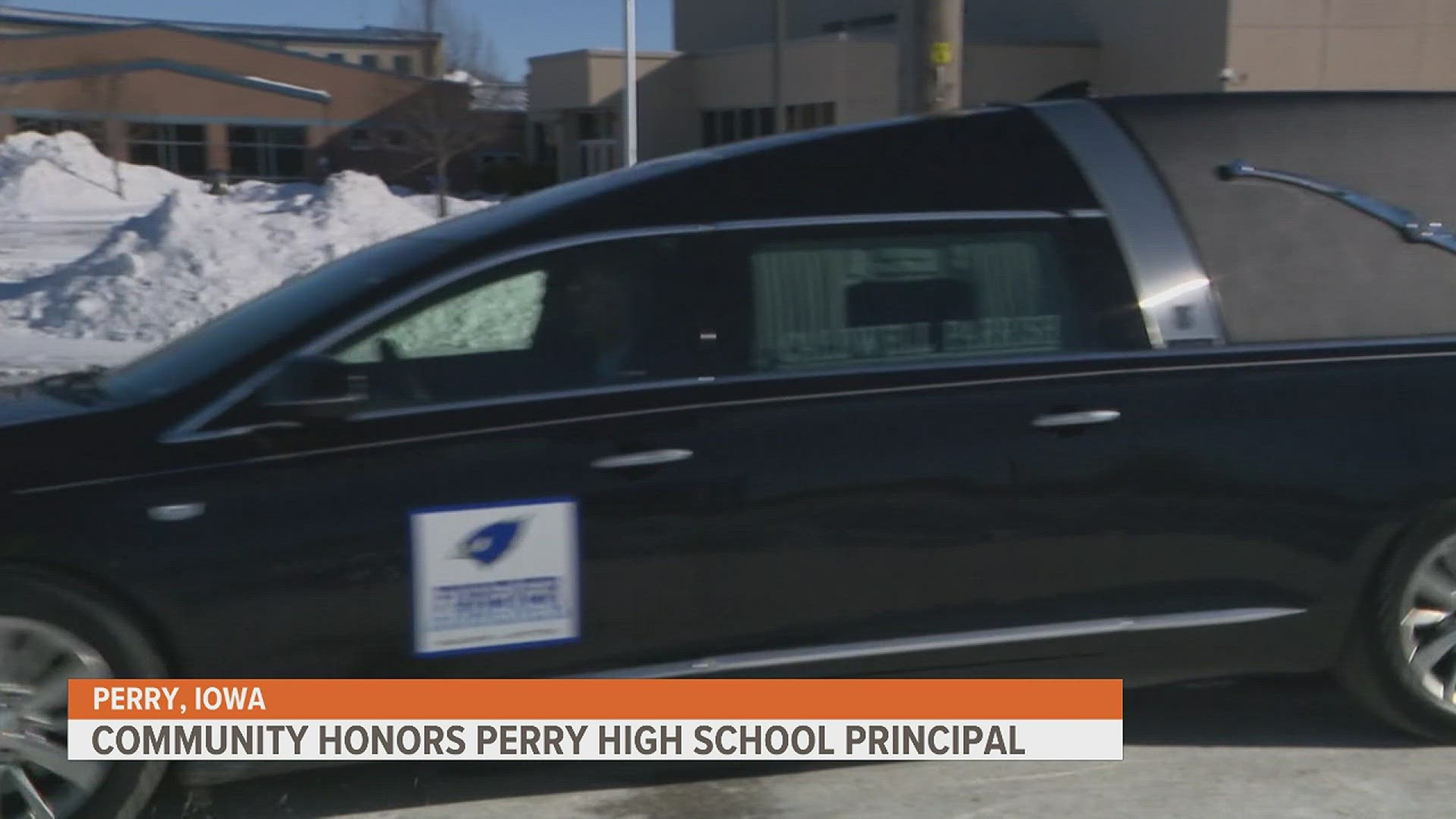 Community members and students lined the street Tuesday to honor Dan Marburger, who distracted the shooter and helped save numerous people.