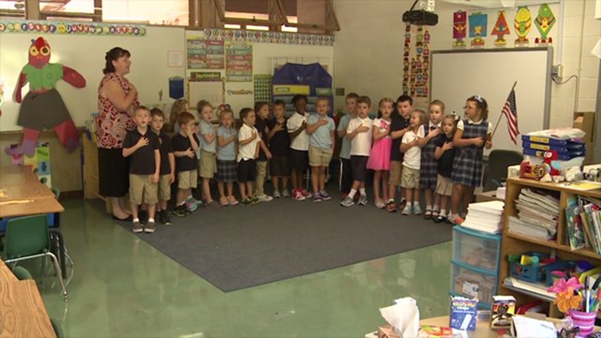 Ms. Hahn`s class says the Pledge of Allegiance