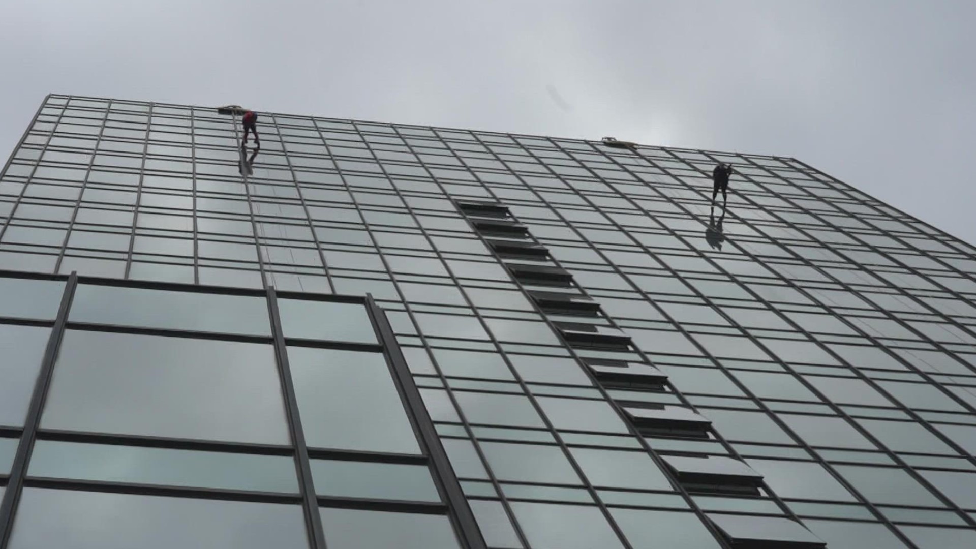 Those weren’t window washers you saw working their way down that tall building.