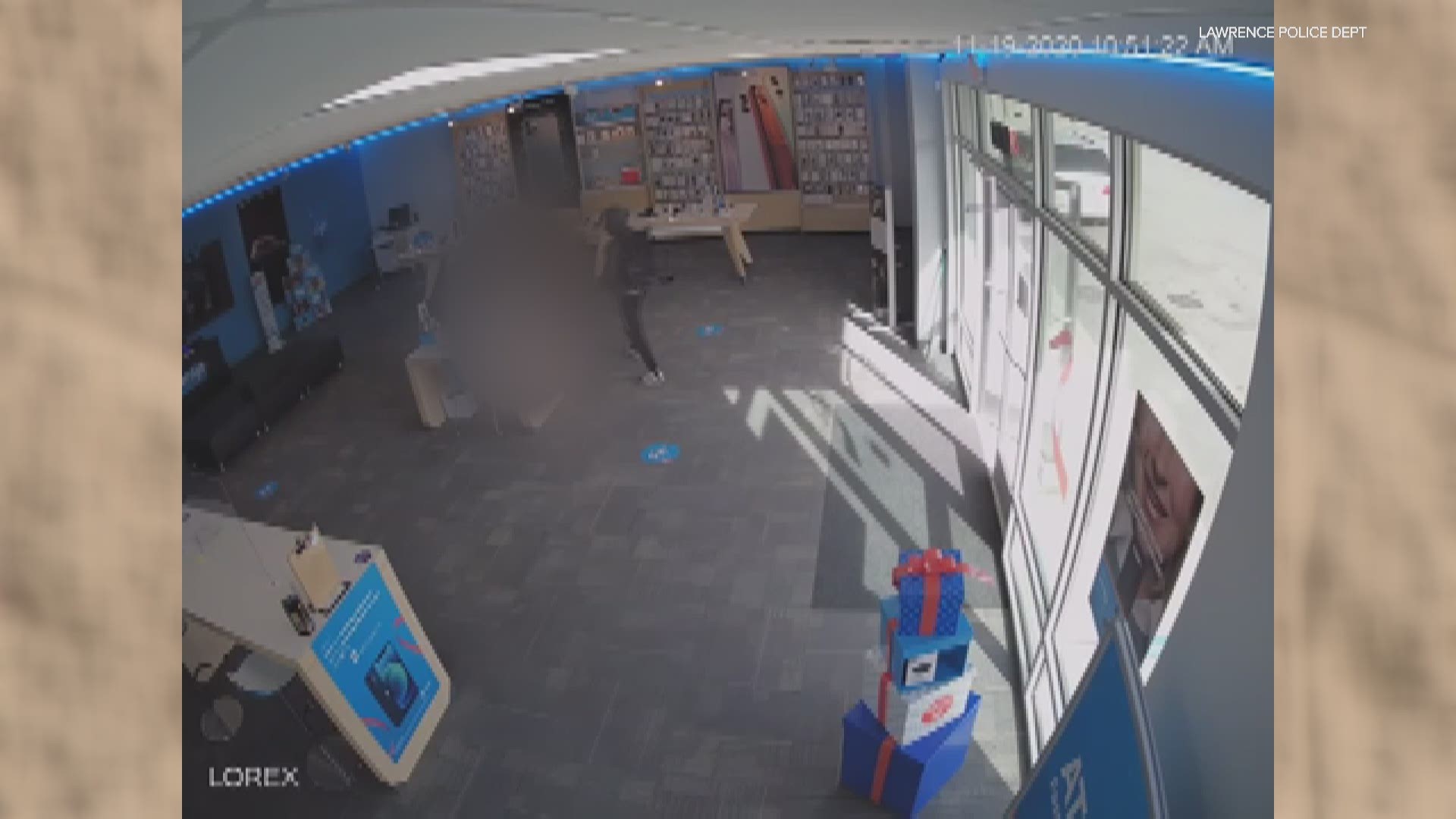 Lawrence Police hope surveillance video will help identify the suspect from a robbery at an AT&T store.