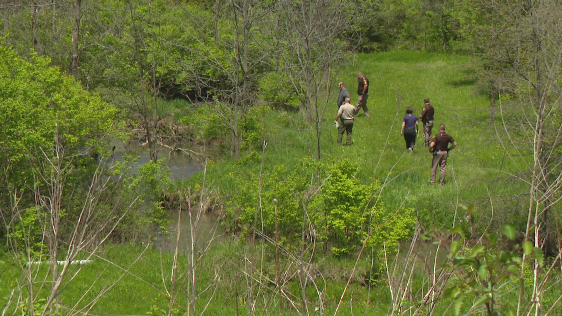 A deputy found the child in moving water and pulled him out of the creek. His 3-year-old sister also went into the water but was able to get out.