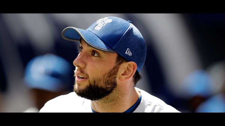 Injured Indianapolis Colts quarterback Andrew Luck watches as