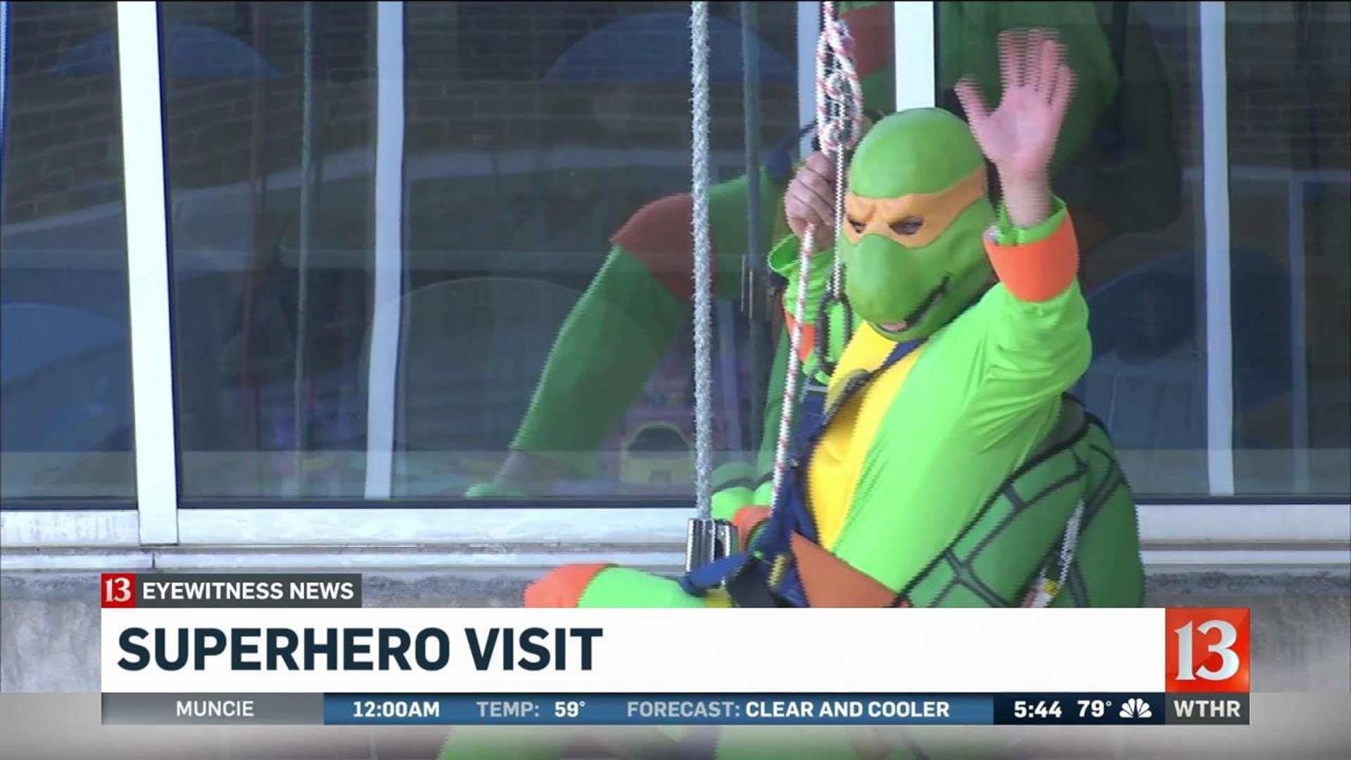 Superhero window washers visit hospital