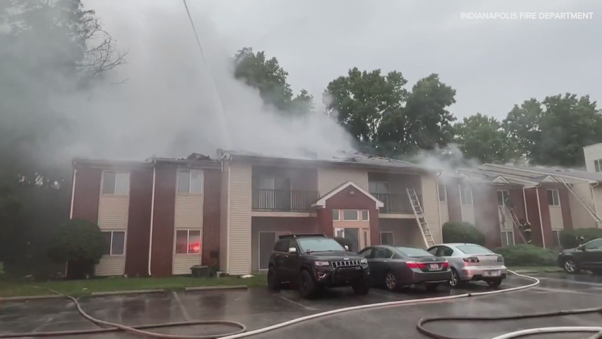 Two firefighters suffered minor injuries while battling a fire at a Marian University apartment building early Saturday.