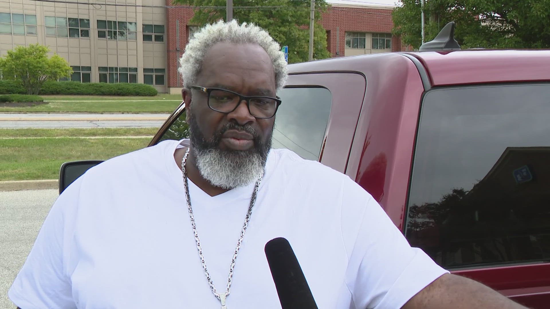 A former assistant coach under Carlisle organized a rally for supporters today across the street from Ben Davis.