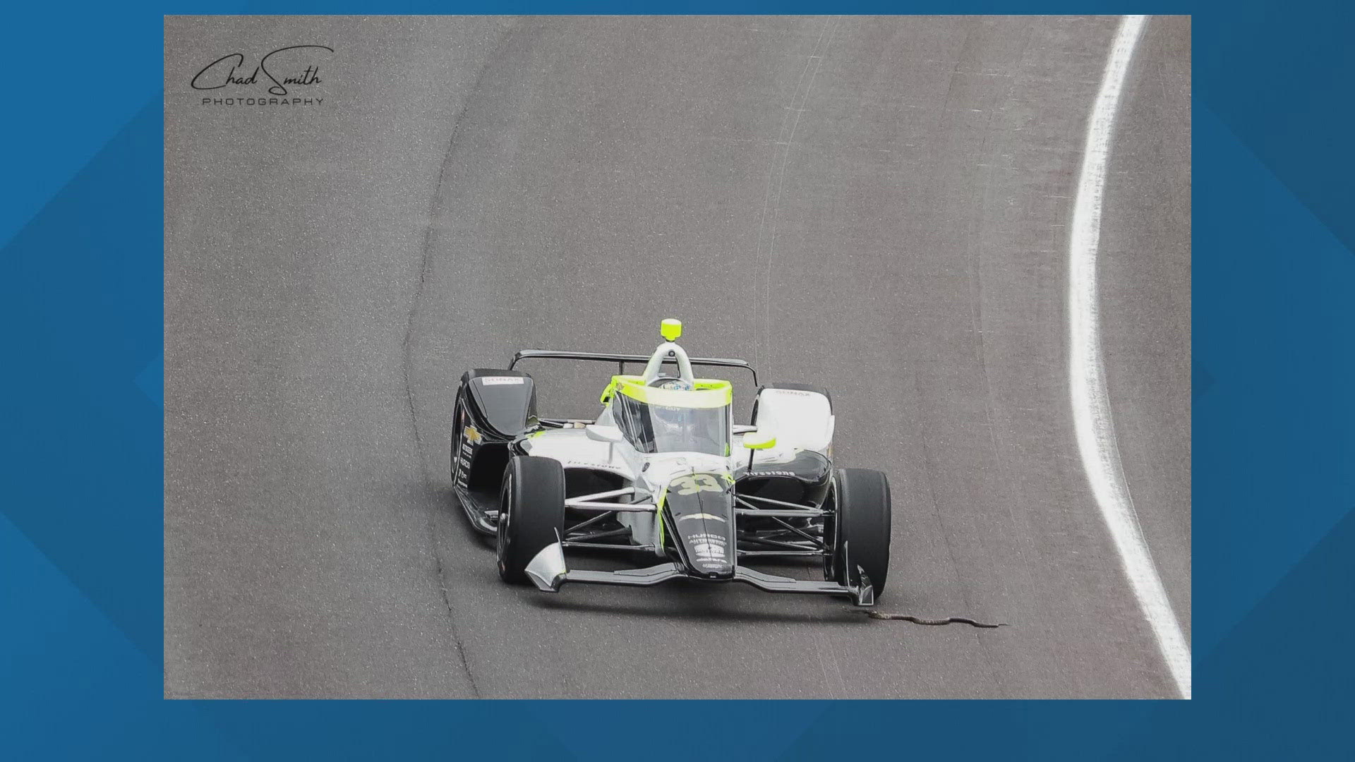 This was in turn one and that is Indycar driver Christian Rasmussen. His front tire about to run right over that reptile.