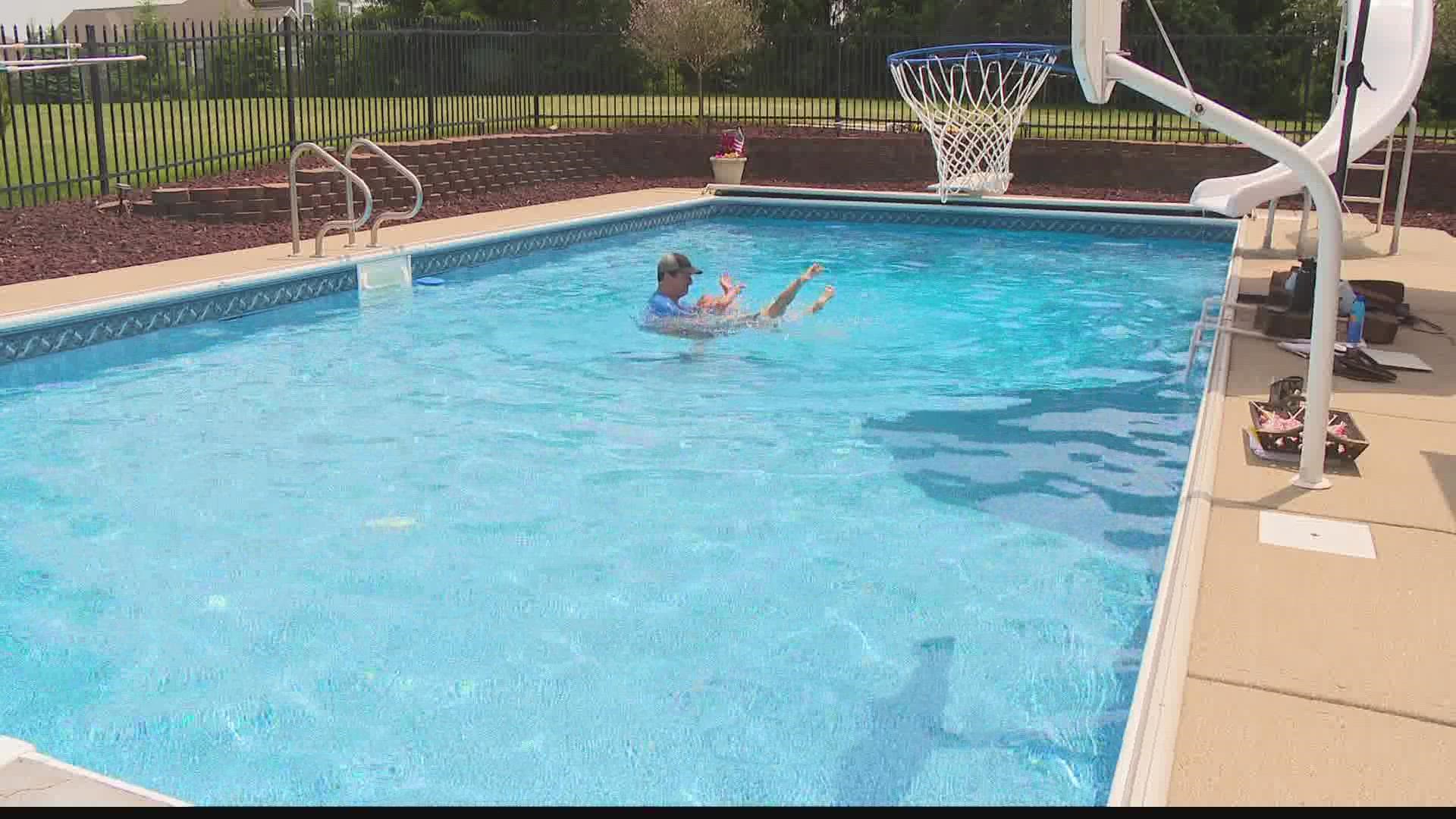 Matt Papachronis teaches water survival skills to infants from his private pool in Fortville.