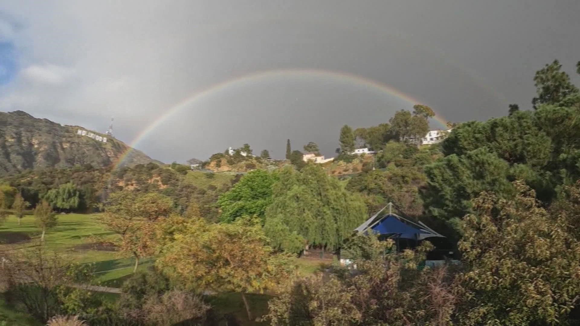 Thursday's winter blast in the Los Angeles area eventually gave way to a magical moment, as a double rainbow stretched across the sky near the famed "Hollywood" sign