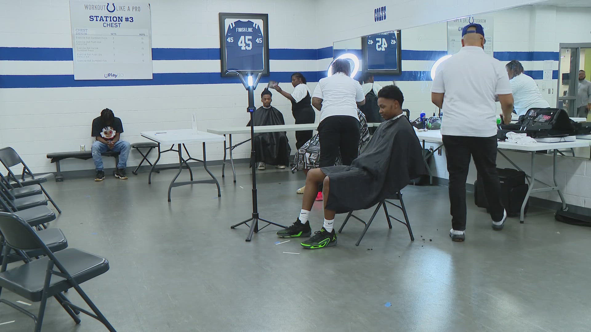 It's a joint collaboration between a barber shop and a local organization.