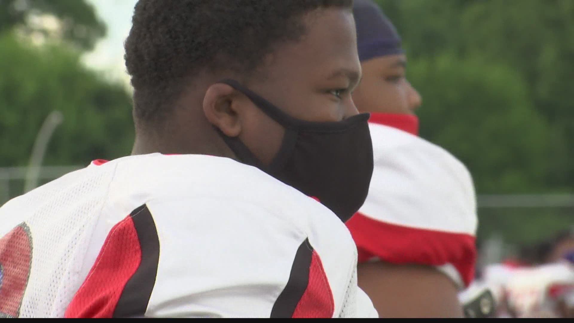 Two local high school football teams are coming together on the field, trying to get an important message out.
