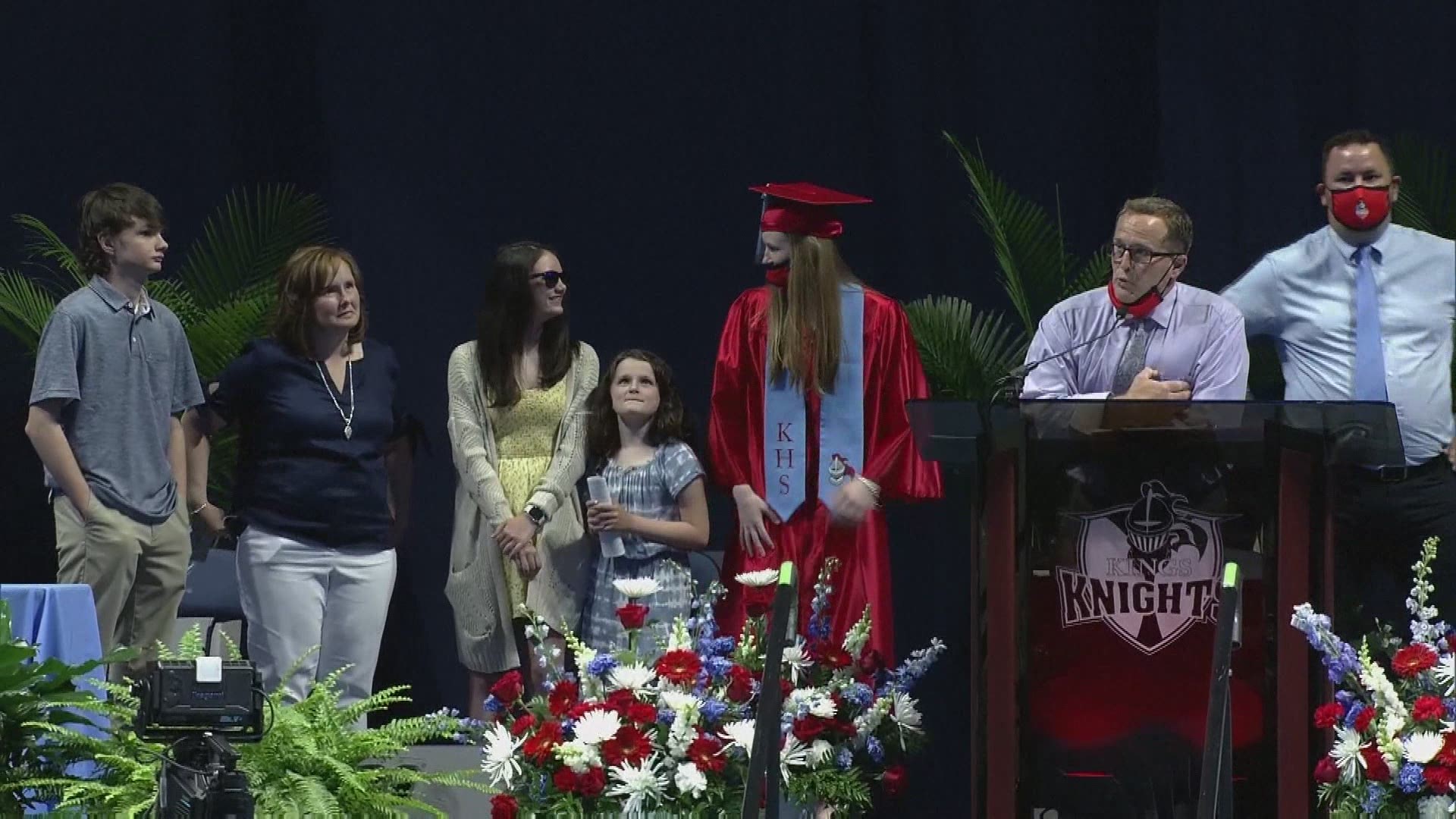 Grace Macke thought she would just be viewing a video message from her dad, but instead, he came out onto the stage to surprise her.