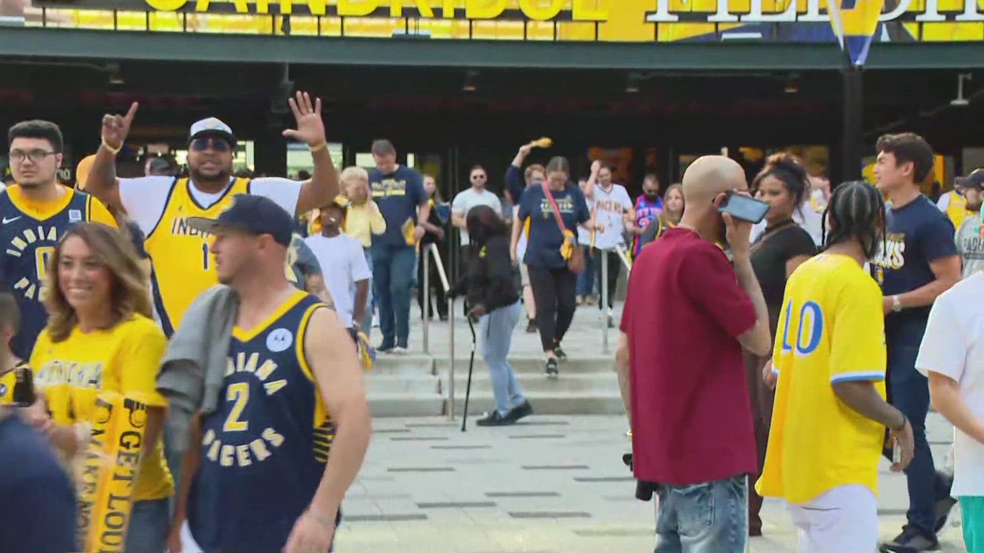 13News reporter Logan Gay talks to fans outside Gainbridge Fieldhouse after the Pacers beat the Knicks to even the playoff series at 2-2.