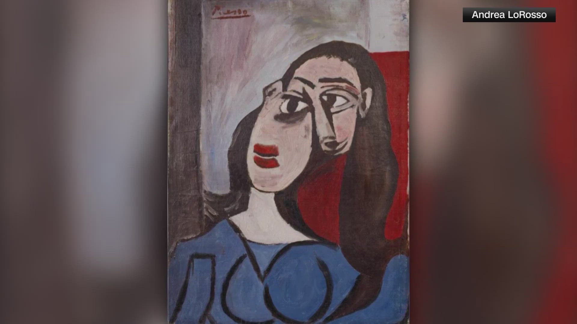 The painting, valued at $6.6 million, features Picasso's asymmetrical style of a woman wearing a blue dress with red lipstick.